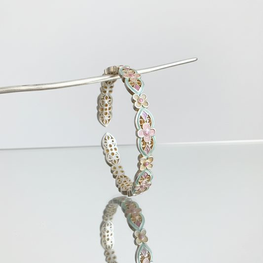 Handcrafted enamel cuff bracelet with hand-colored petals and vintage Chinese bangle design
