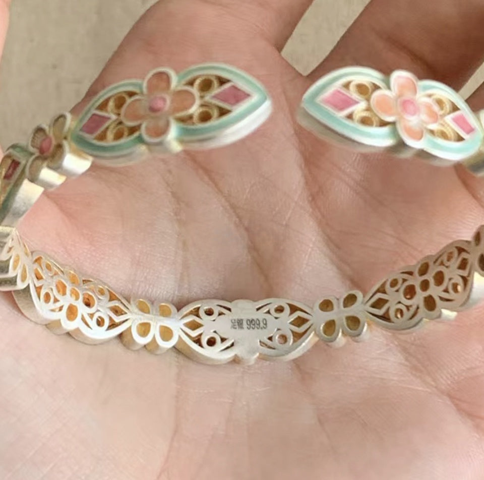 Handcrafted enamel cuff bracelet with hand-colored petals and vintage Chinese bangle design

