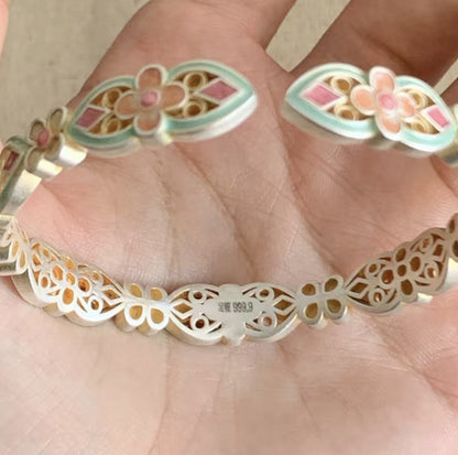 Handcrafted enamel cuff bracelet with hand-colored petals and vintage Chinese bangle design
