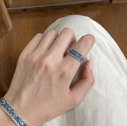 Blue and green peacock enamel ring with oxidized silver and adjustable band
