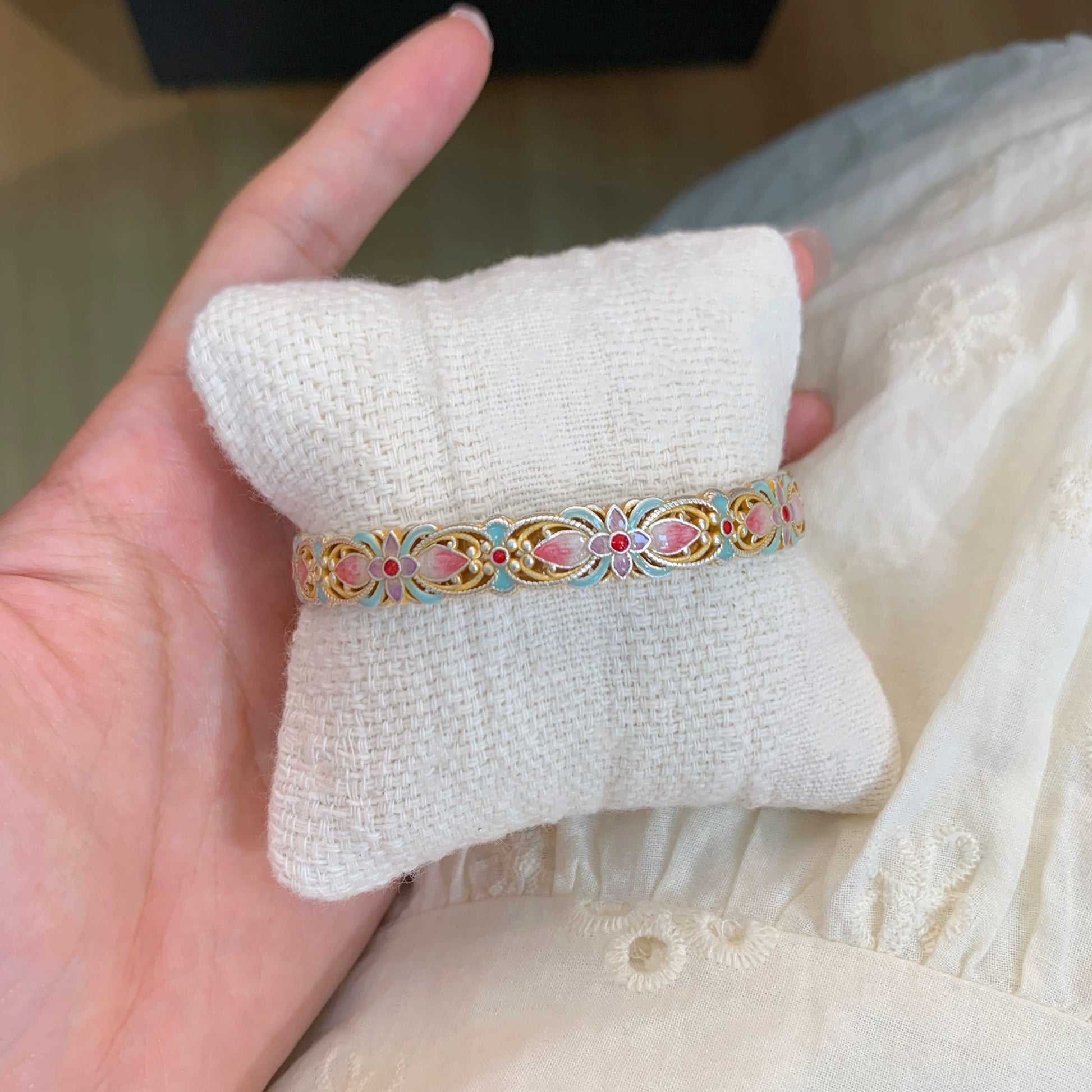 Handmade bracelet using filigree and enamel techniques, blooming with intricate floral patterns — a piece of Chinese enamel jewelry.
