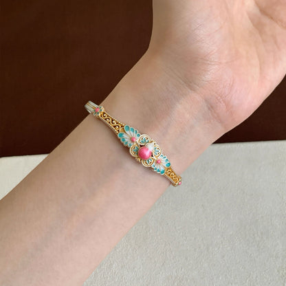 Handmade bracelet blending filigree and enamel that blooms with intricate floral patterns — a wearable garden of eastern elegance.
