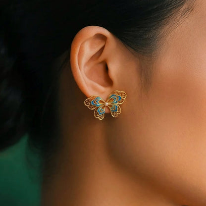 Gold-plated silver butterfly earrings crafted with filigree inlay, handmade jewelry symbolizing freedom and beauty in an oriental aesthetic.