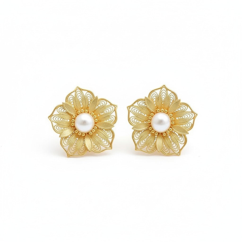 Handmade silver stud earrings featuring cherry blossom filigree inlay, part of our handmade silver jewelry collection inspired by oriental elegance.