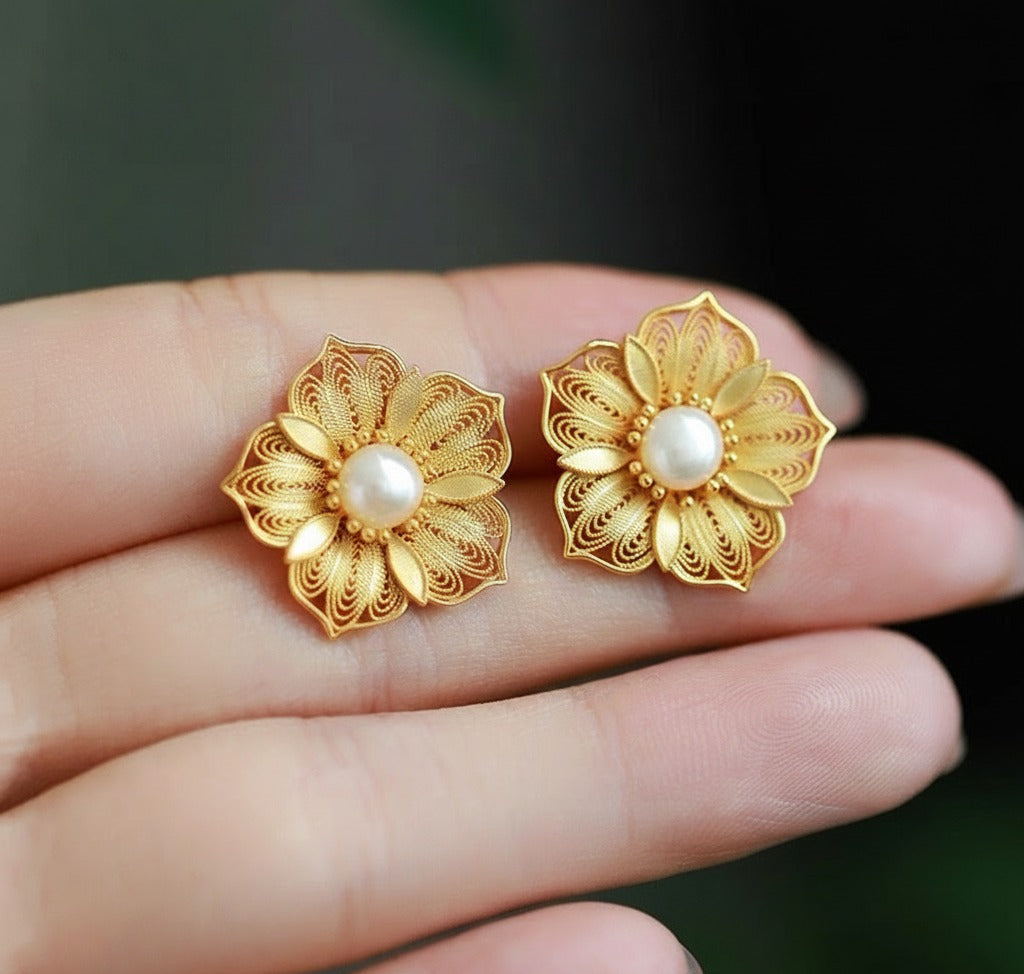 Handmade silver stud earrings featuring cherry blossom filigree inlay, part of our handmade silver jewelry collection inspired by oriental elegance.