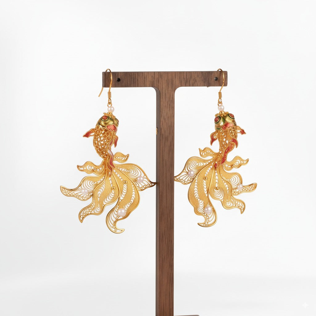 Handmade silver stud earrings depicting koi fish in intricate filigree — symbolizing luck, courage, and prosperity.