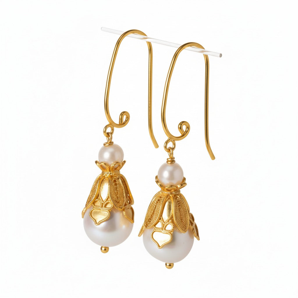 Handmade silver earrings featuring natural pearls set in delicate filigree — lightweight and elegant, perfect for everyday wear or gifting.
