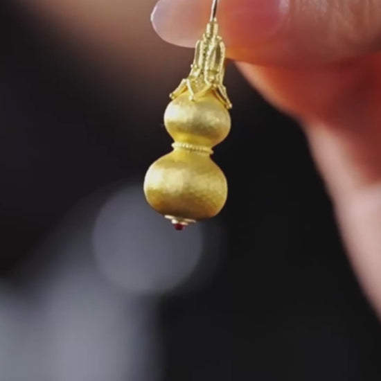 Gold-plated sterling silver gourd stud earrings with filigree-style texture
