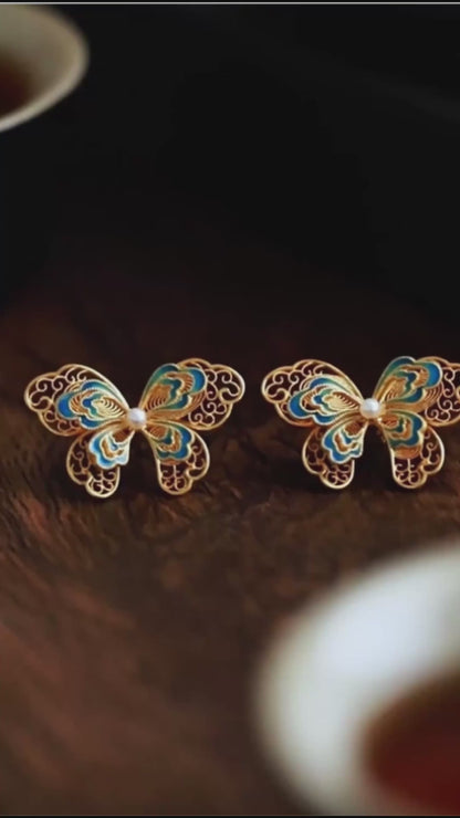 Gold-plated silver butterfly earrings crafted with filigree inlay, handmade jewelry symbolizing freedom and beauty in an oriental aesthetic.mp4
