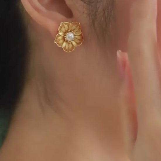 Handmade silver stud earrings featuring cherry blossom filigree inlay, part of our handmade silver jewelry collection inspired by oriental elegance.mp4